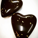 Dark chocolate hearts with real flakes of gold. (Source: @chocolatemakersstudio)