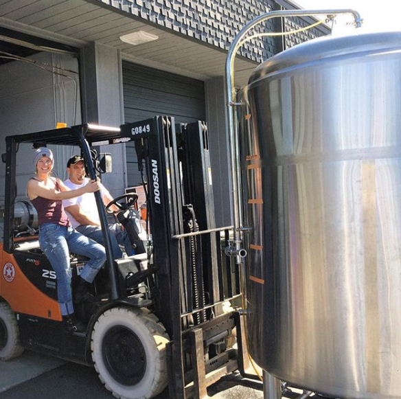 Moving a cold brew tank at the brewing facility