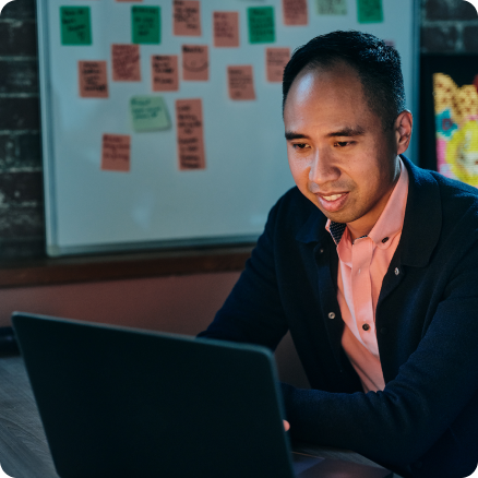 Professional working late at laptop in office