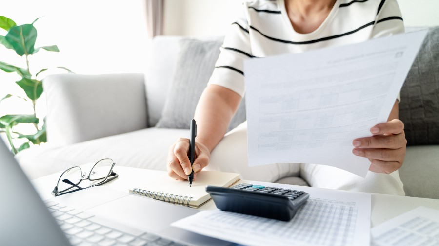 A woman calculating her inheritance tax