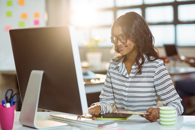 Graphic designer working on computer in office