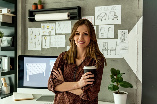 Young interior designer working in her studio