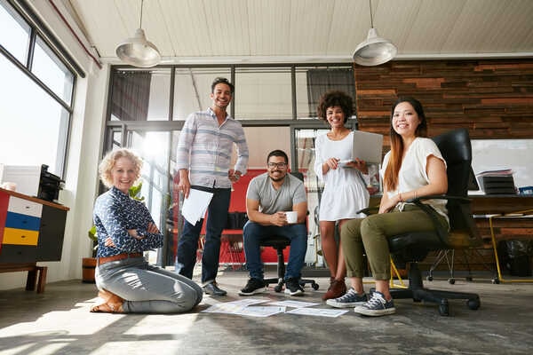 A group of people sitting around a table.