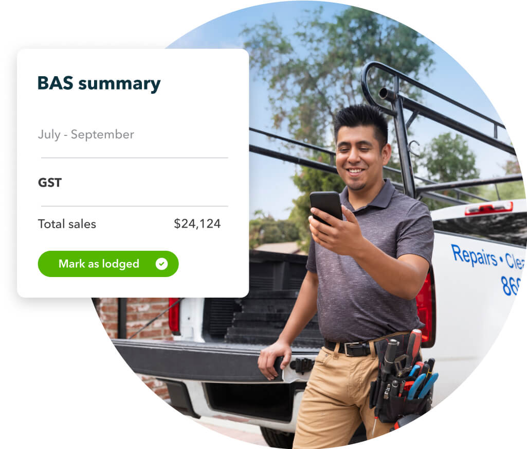 Small business owner smiling while glancing at the BAS summary on the QuickBooks App.
