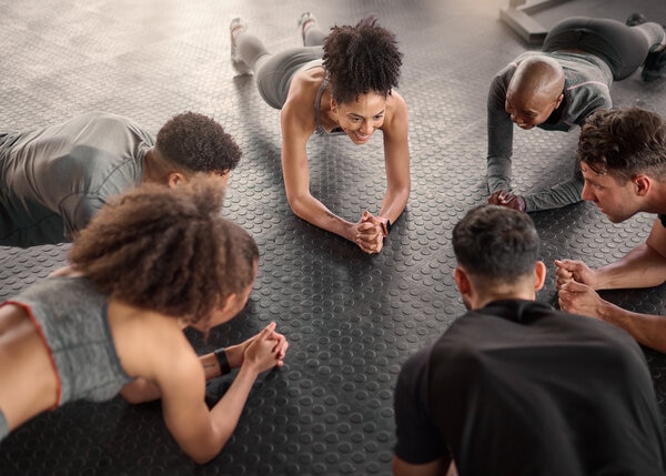 A group of people sitting around a round table.