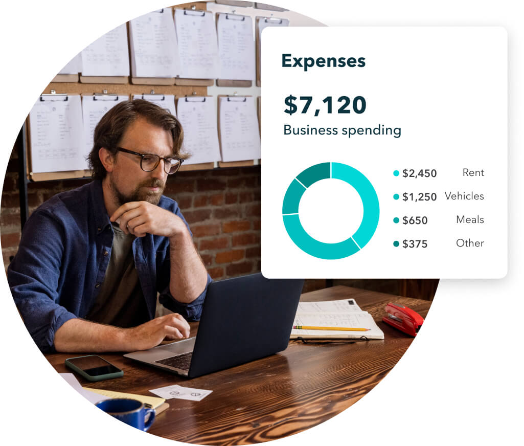 Manager reviewing expenses on QuickBooks expense tracking software.