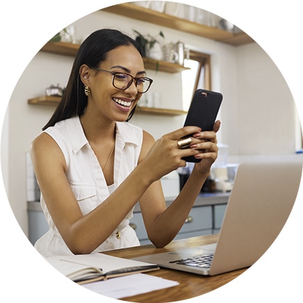 Happy woman looking at phone