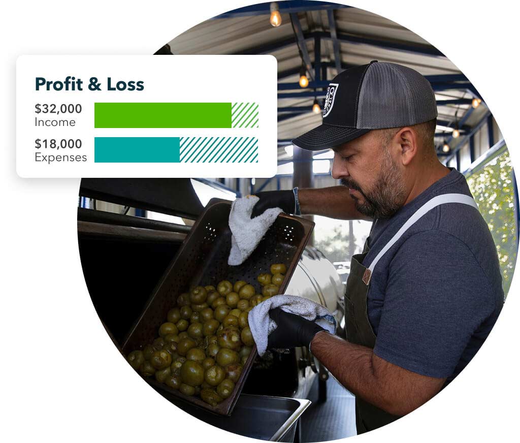 Small business owner sorting fruits after viewing the profit and loss report on QuickBooks