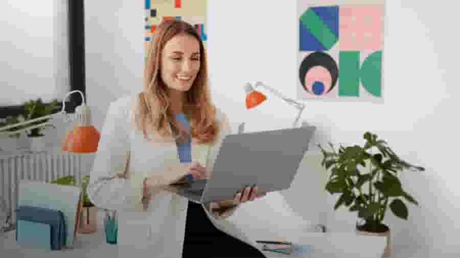 Female business owner using her laptop to send out reports