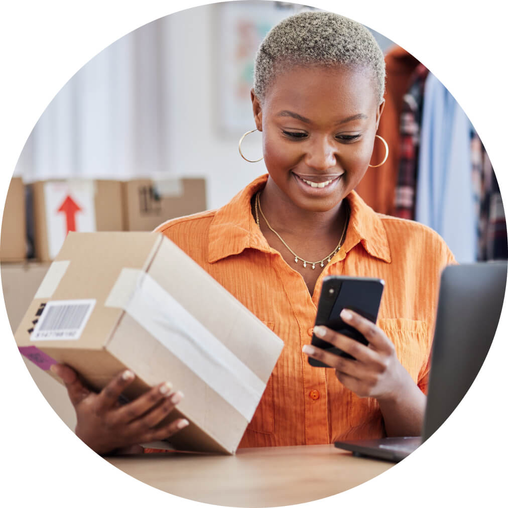 A person holding a cell phone in her hands.