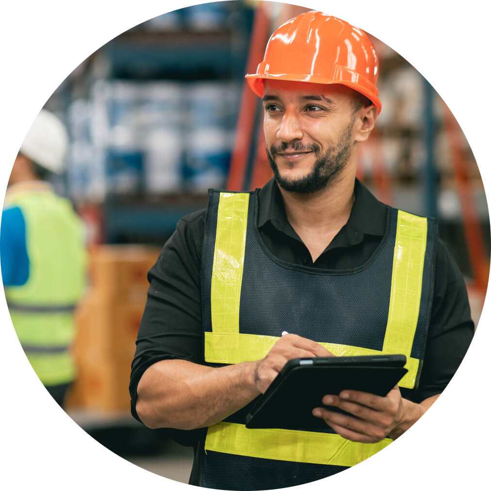 A construction worker, using QuickBooks app on a tablet to view cash flow planner