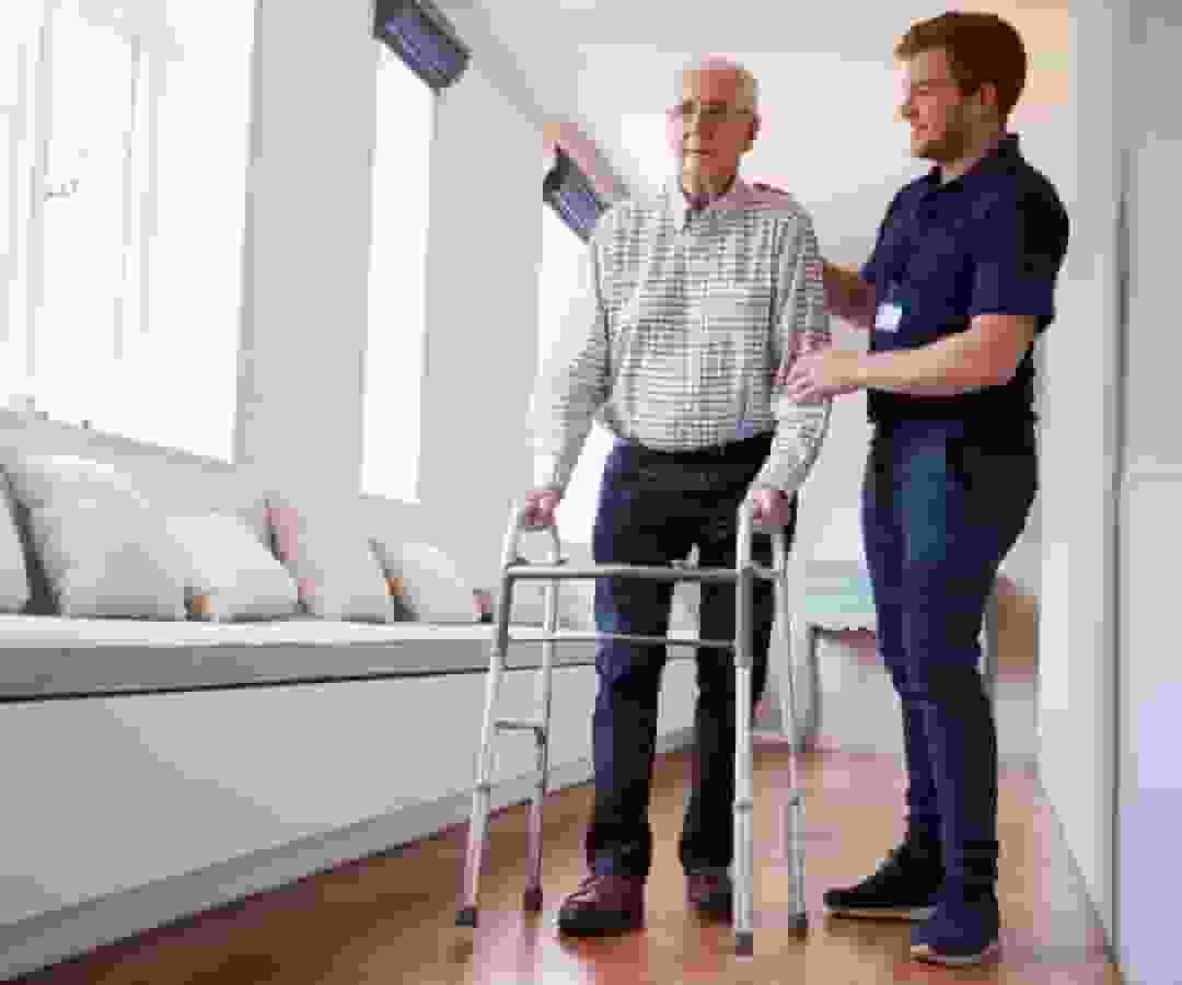 A person in a wheelchair is standing on a stool.