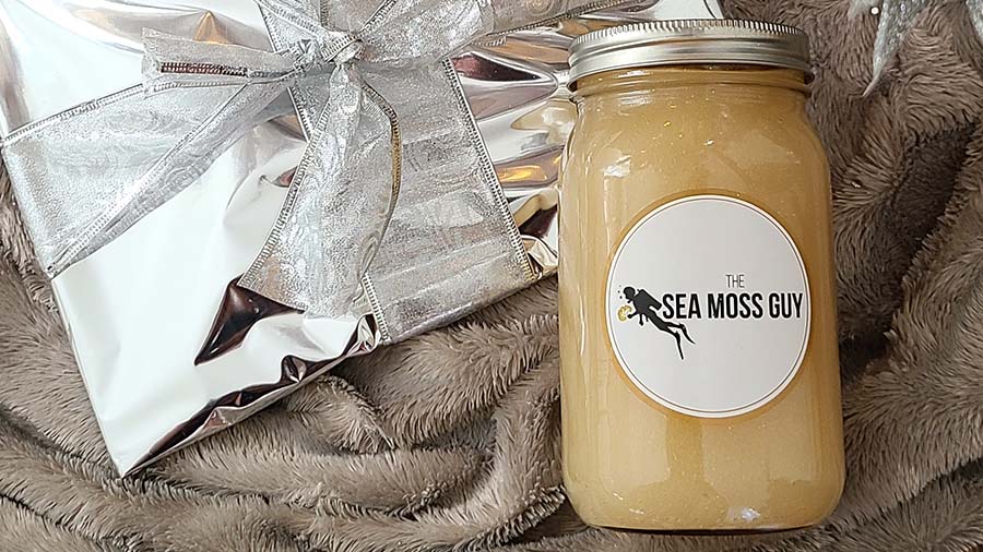 The Sea Moss Guys smoothie beside packaged gift