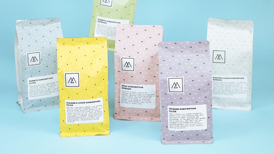 Bags of different flavoured coffee grounds 