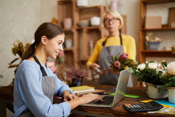 small business owner processing her payroll in her flower shop