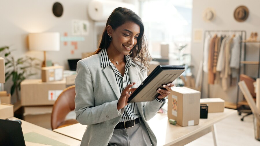 A woman looking at a tablet