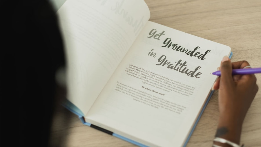 A woman is reading a journal  with a pen