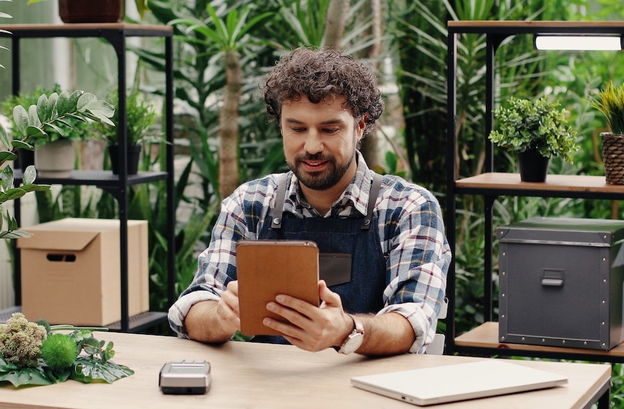 Small business owner reviewing his payroll paperwork