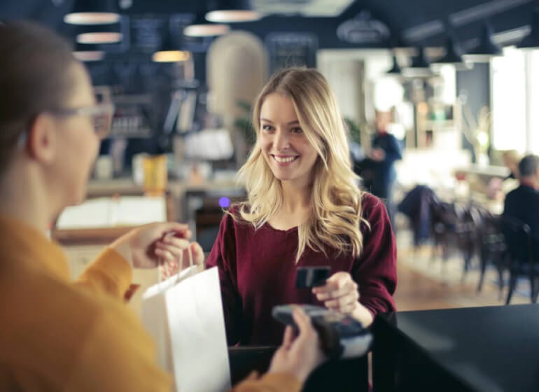 Woman paying in a shop