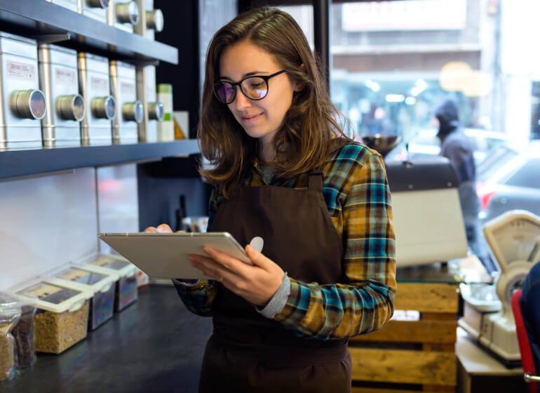 Young lady checking shelf products