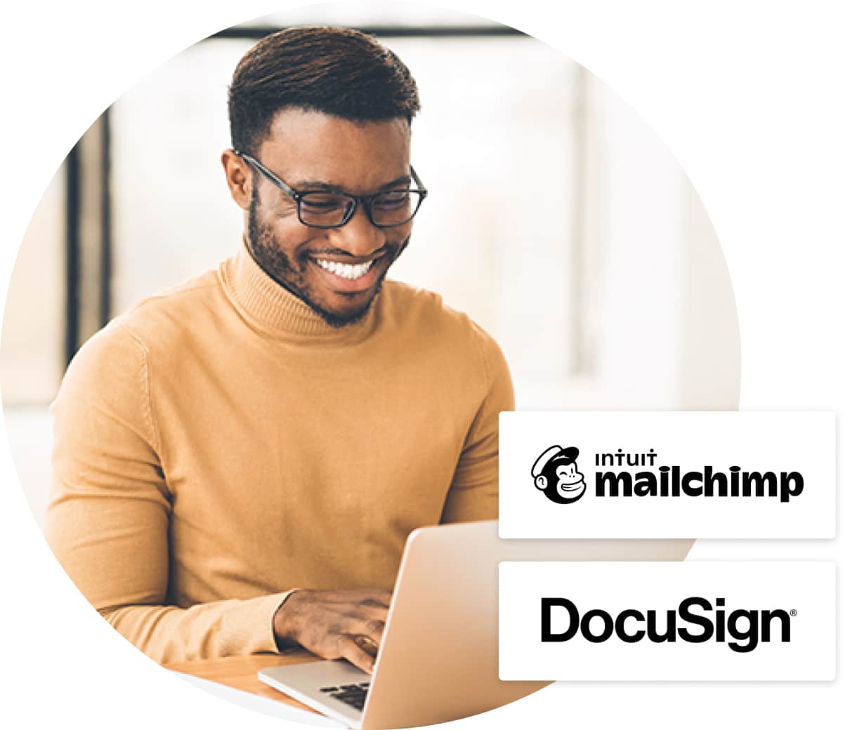 Smiling man in beige turtleneck typing at laptop, Docusign and Mailchimp logos over top 