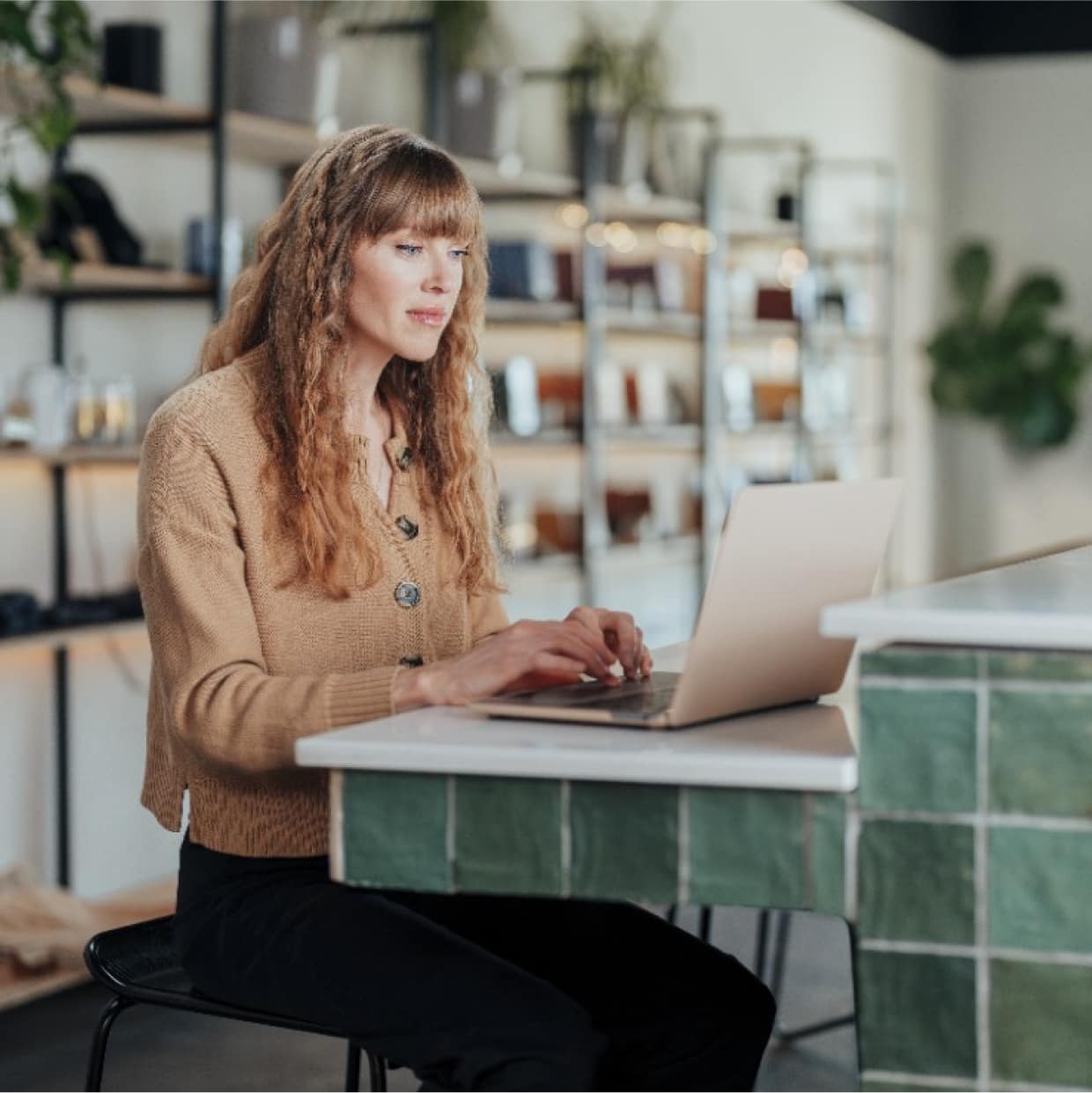 Ritual chocolate owner Anna Seear working in front of laptop.