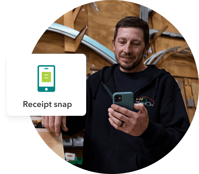 A small business owner looks at his smartphone. A pop-up shows a receipt snap icon.