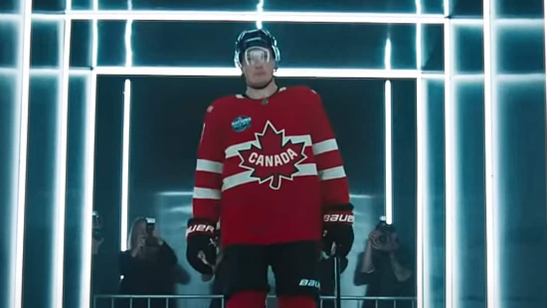 A 4 nations Team Canada player walking down a hallway