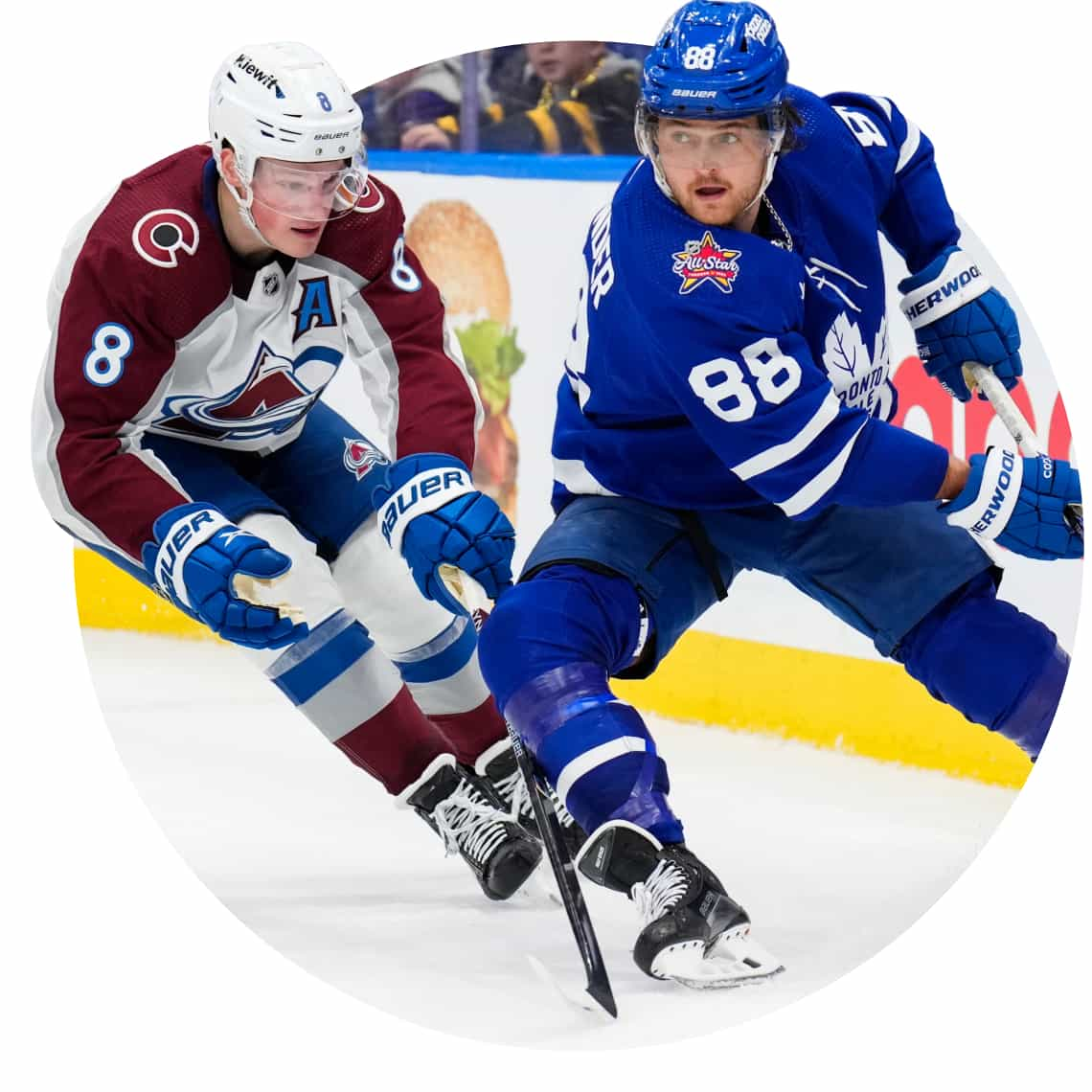 NHL player William Nylander skates behind the net with the puck, with defence man Cale Makar tight on his heels. 