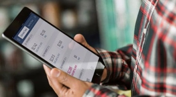 Man checking financial data on tablet