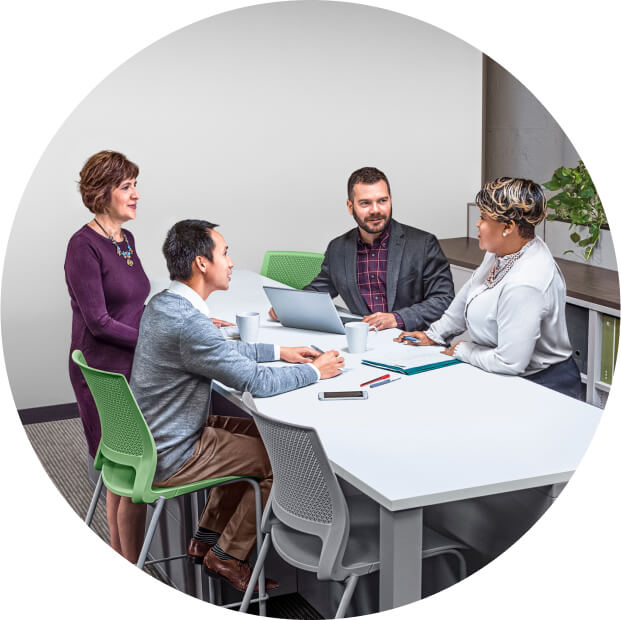 A group of people sitting at a table.