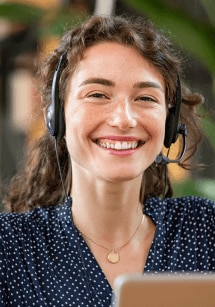 A picture of a person with a hair dryer in her hair.