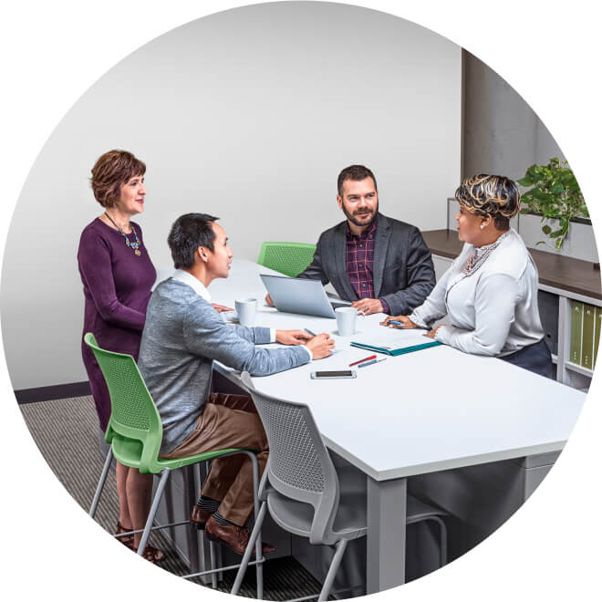 A group of people sitting at a table.