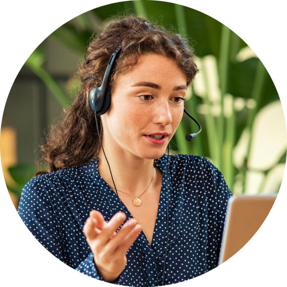 A person talking on a cell phone while wearing headphones.