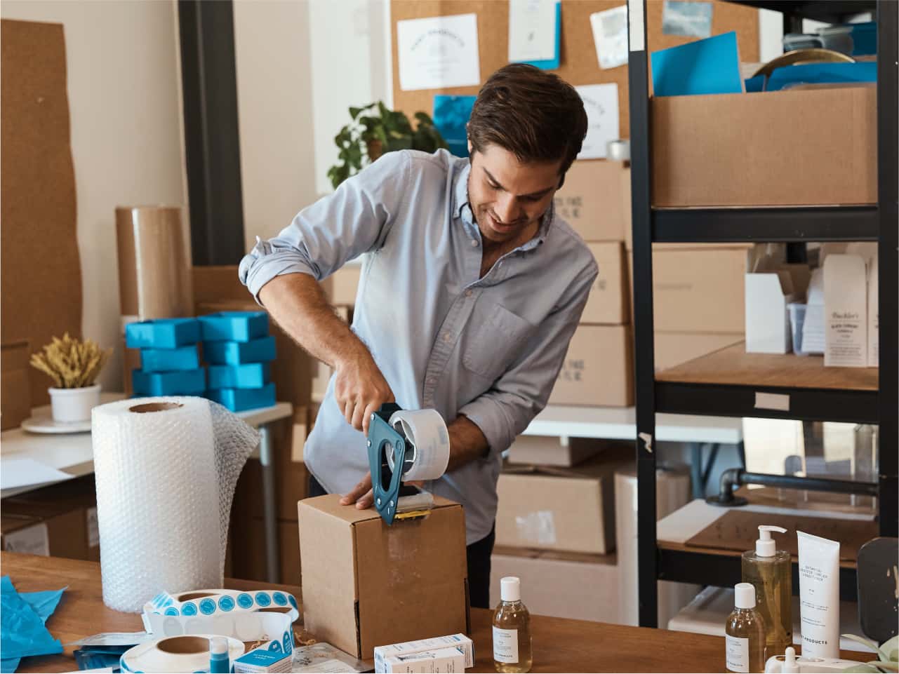 A person is in a room with boxes of boxes.