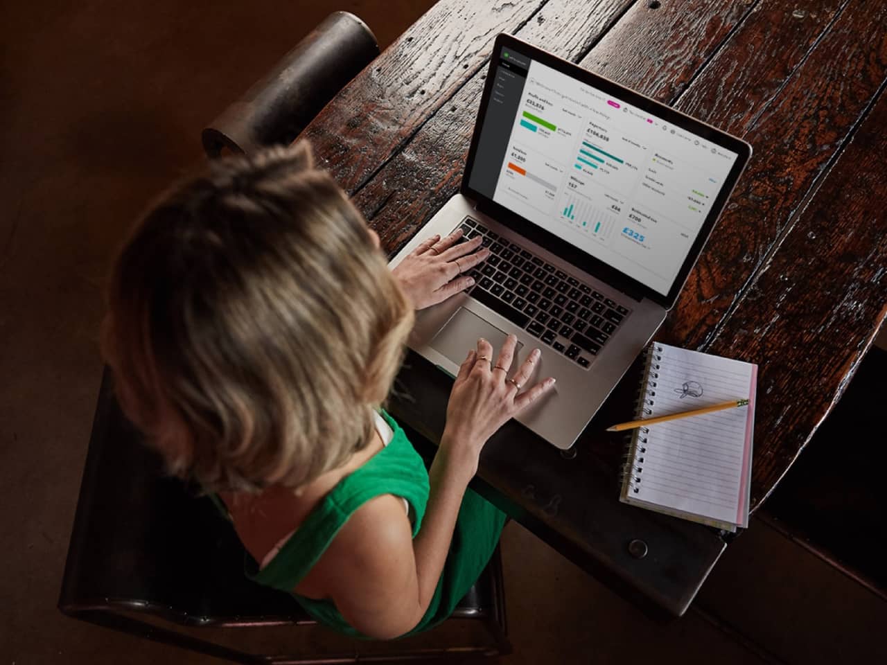 Image of person using a laptop at a desk