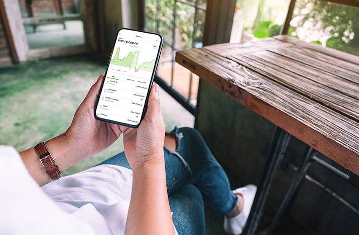 A person looking at a mobile phone.