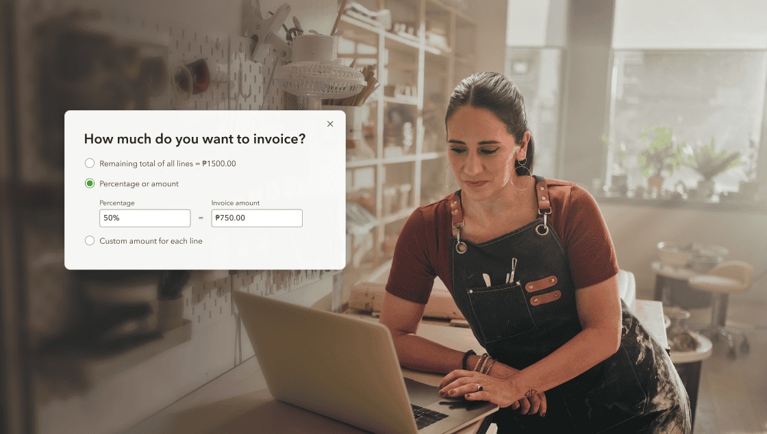 Small business owner using laptop for invoicing