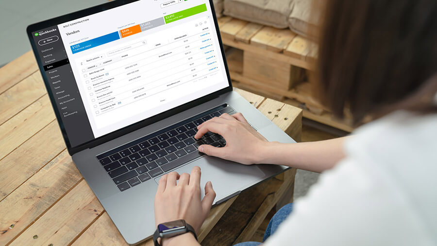 Woman using QuickBooks inventory management software