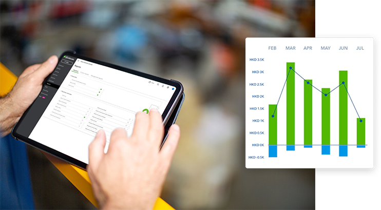 A small business owner is accessing QuickBooks financial reporting software on iPad for business insights
