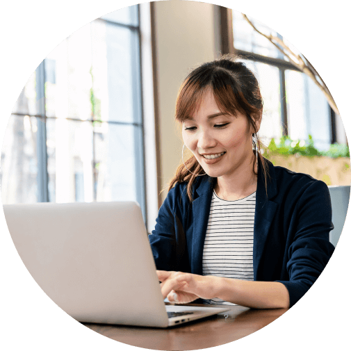 A person with a laptop computer in front of her face.