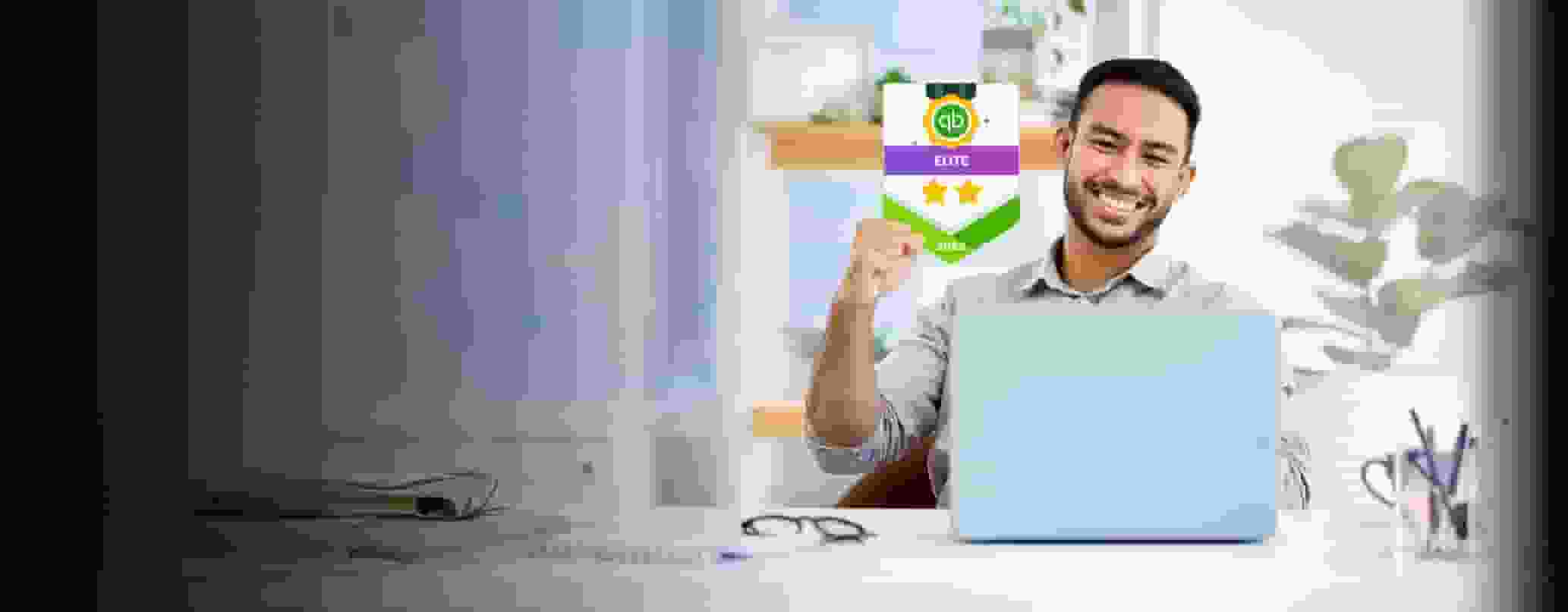 A smiling person holding a green and white laptop.