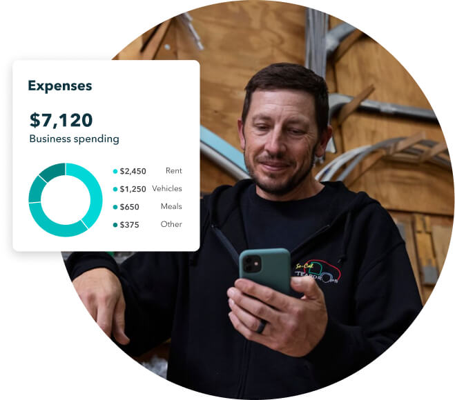 A person is smiling and looking at expense report on a mobile phone.