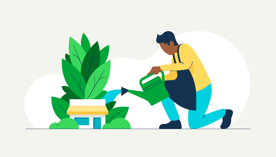 An illustrated person kneels to water a plant situated behind a business building, alluding to the topic of sustainability initiatives in business.