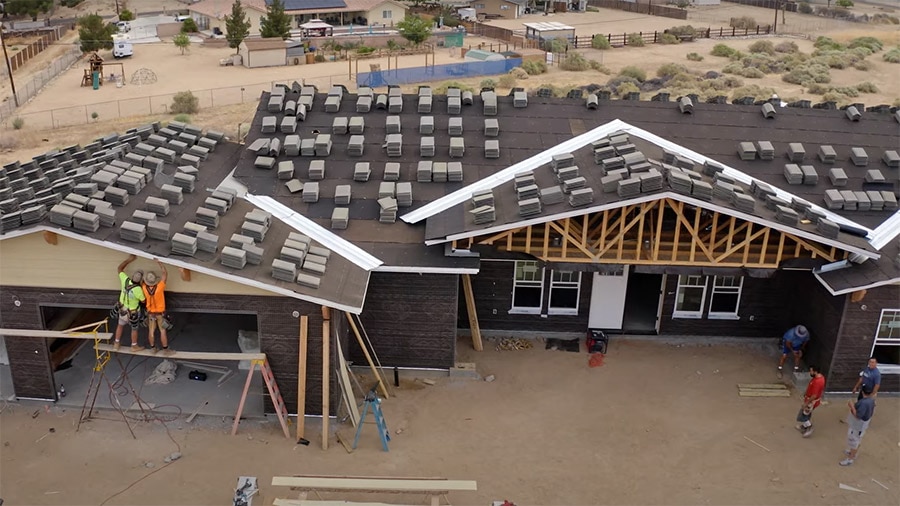 A building with lots of windows and a roof.