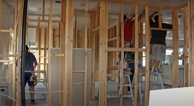A person is working on a kitchen remodel.