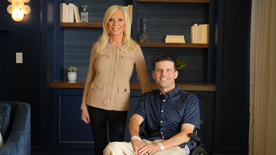 Smiling woman and man in wheelchair indoors
