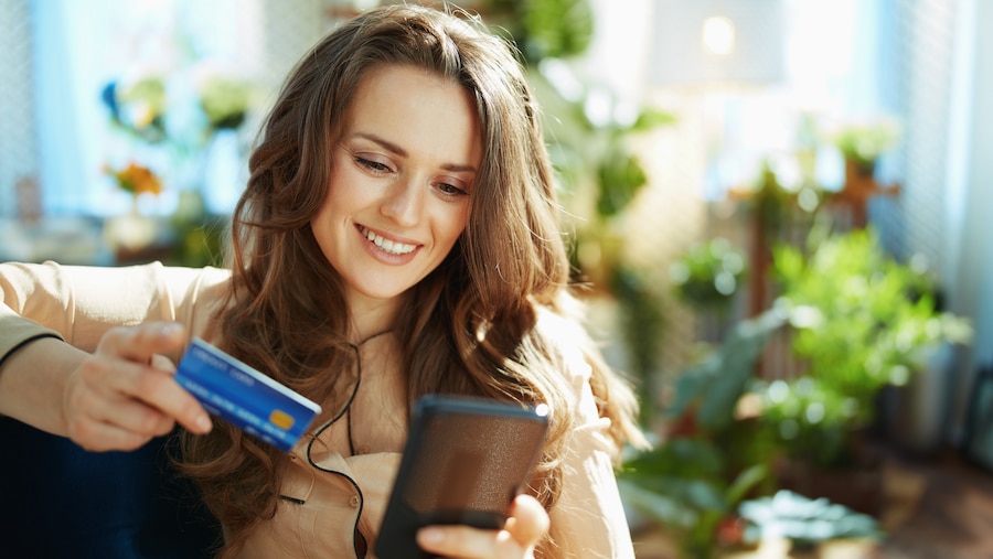 Businesswoman making a payment on her phone.