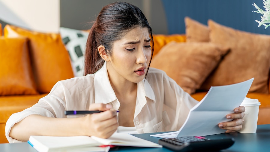 Businesswoman doing deductions on her business taxes.