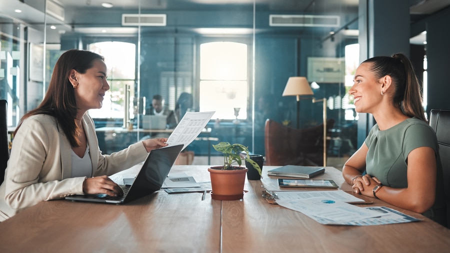 Two women sitting at a table for a Job interview 